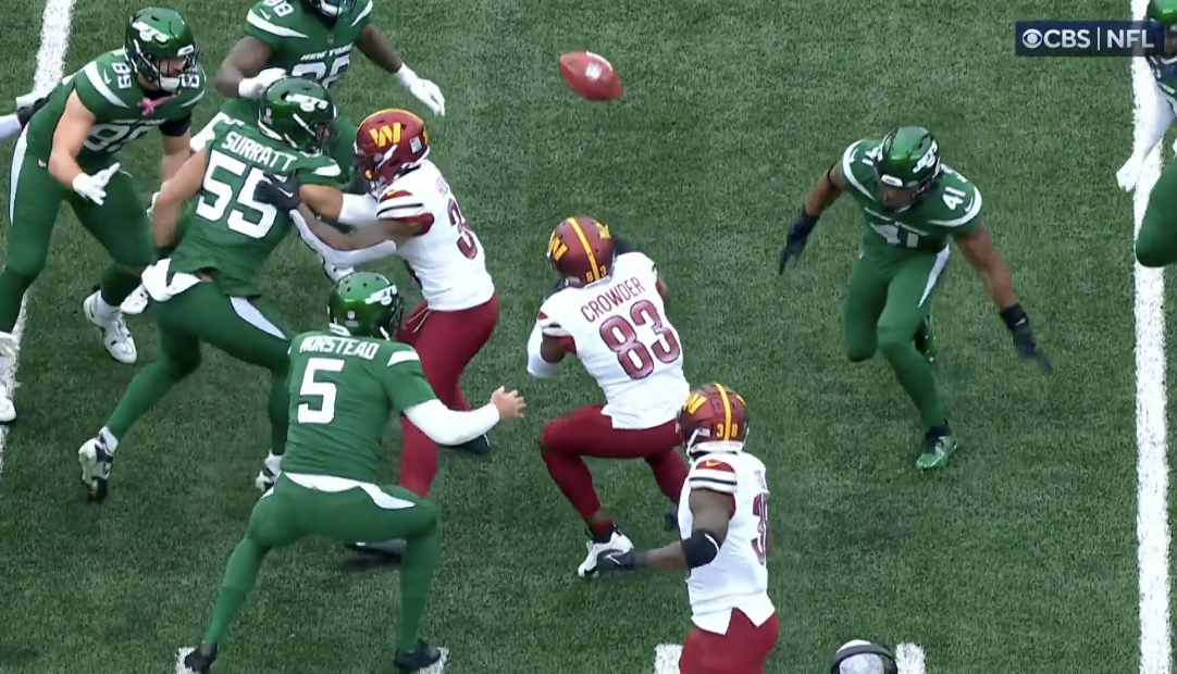 Jamison Crowder (83) had been holding onto the football (top center) until just moments before this picture was taken. (Screenshot)