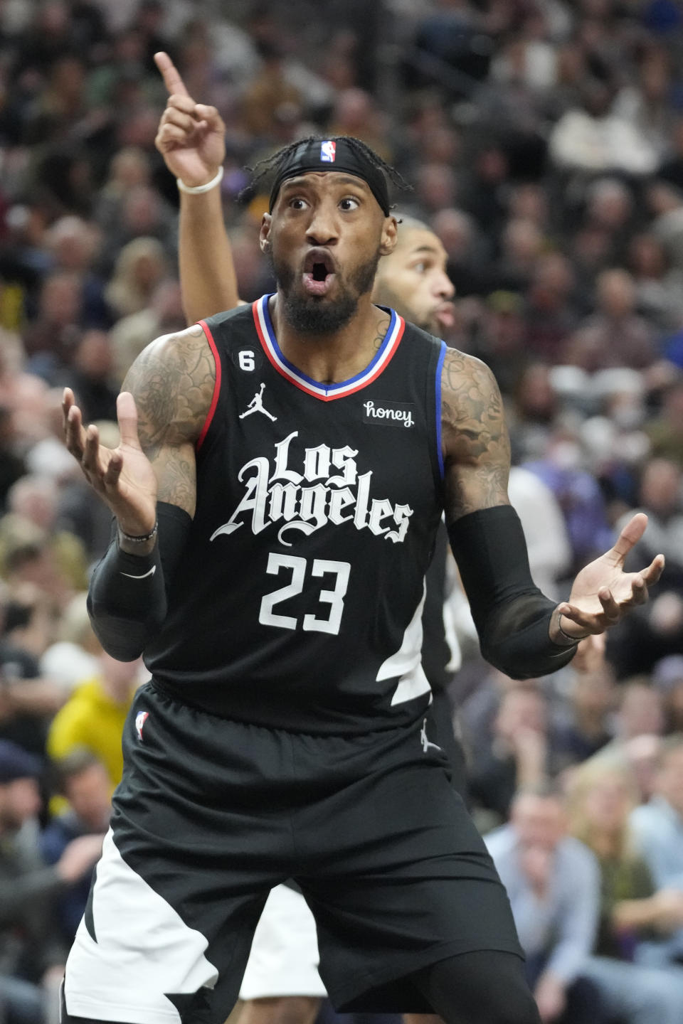 Los Angeles Clippers forward Robert Covington (23) reacts to a call during the first half of an NBA basketball game against the Utah Jazz Wednesday, Nov. 30, 2022, in Salt Lake City. (AP Photo/Rick Bowmer)