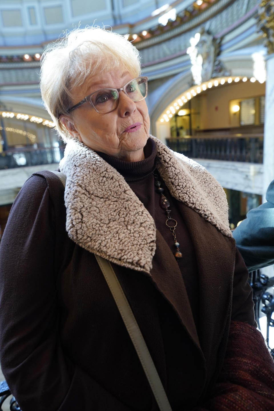 Amanda Jordan of Summit, Miss., a retired nurse practitioner, visits the Mississippi Capitol in Jackson, Miss., on Jan. 27, 2022. She says that a proposal to phase out Mississippi's income tax could influence young people's decisions about whether to live in the state. (AP Photo/Rogelio V. Solis)