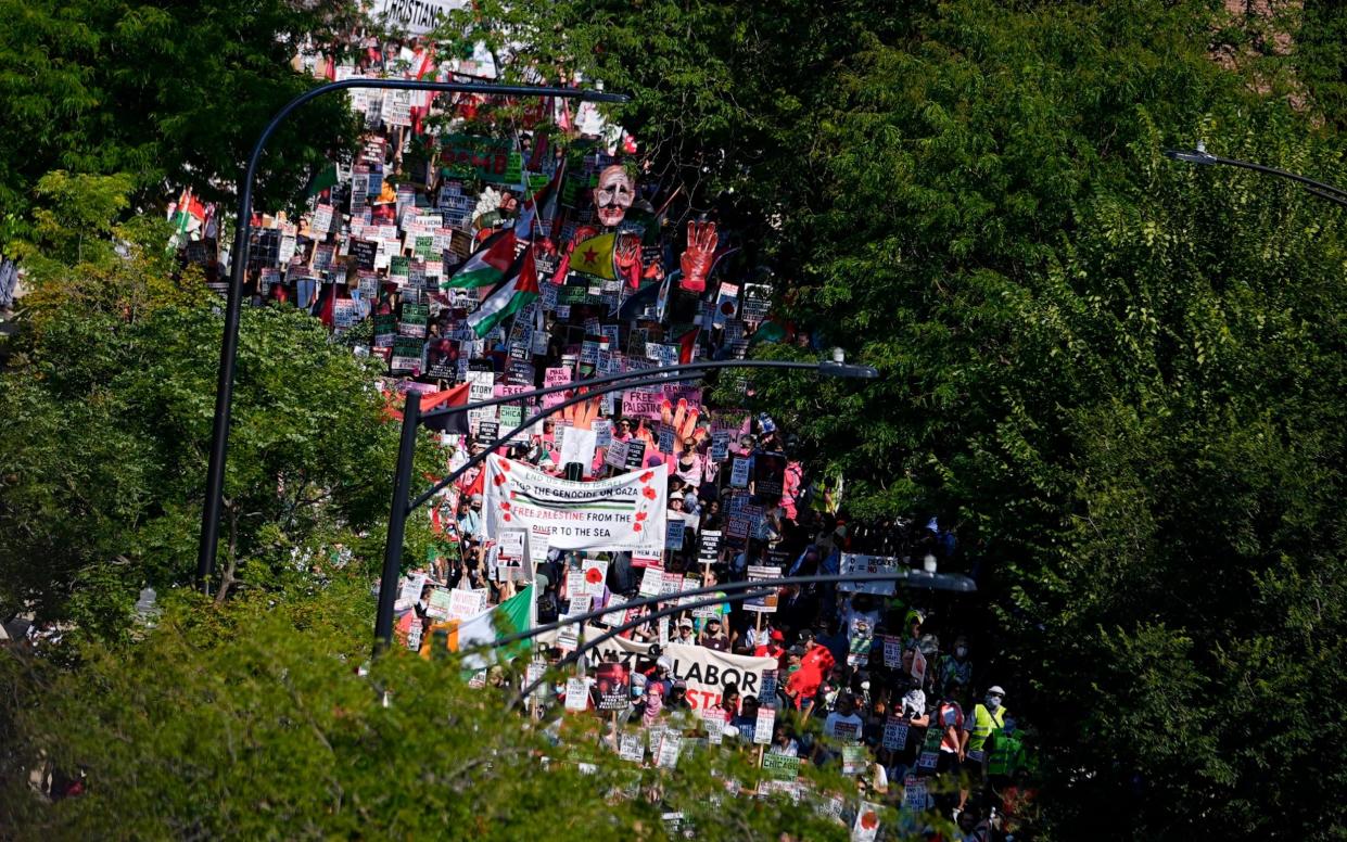 Protesters march on the Democratic National Convention after a rally at Union Park