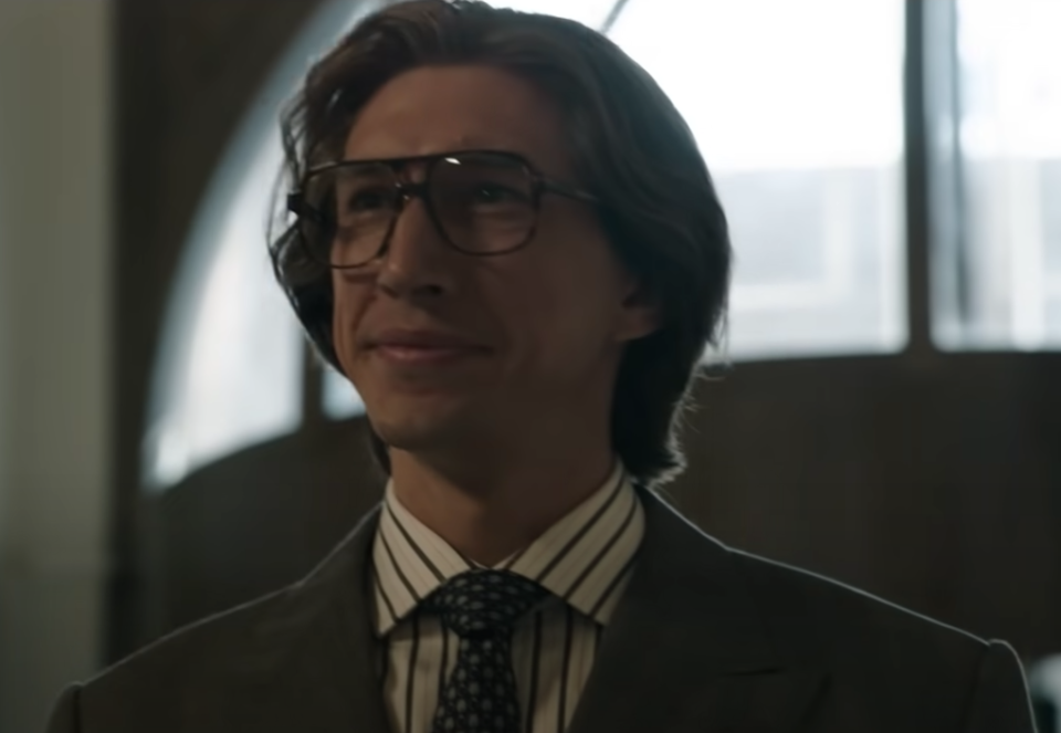 <p>With the hair, 1970s glasses, and Gucci suits, Adam Driver looks pretty darn close to the actual Maurizio.</p>