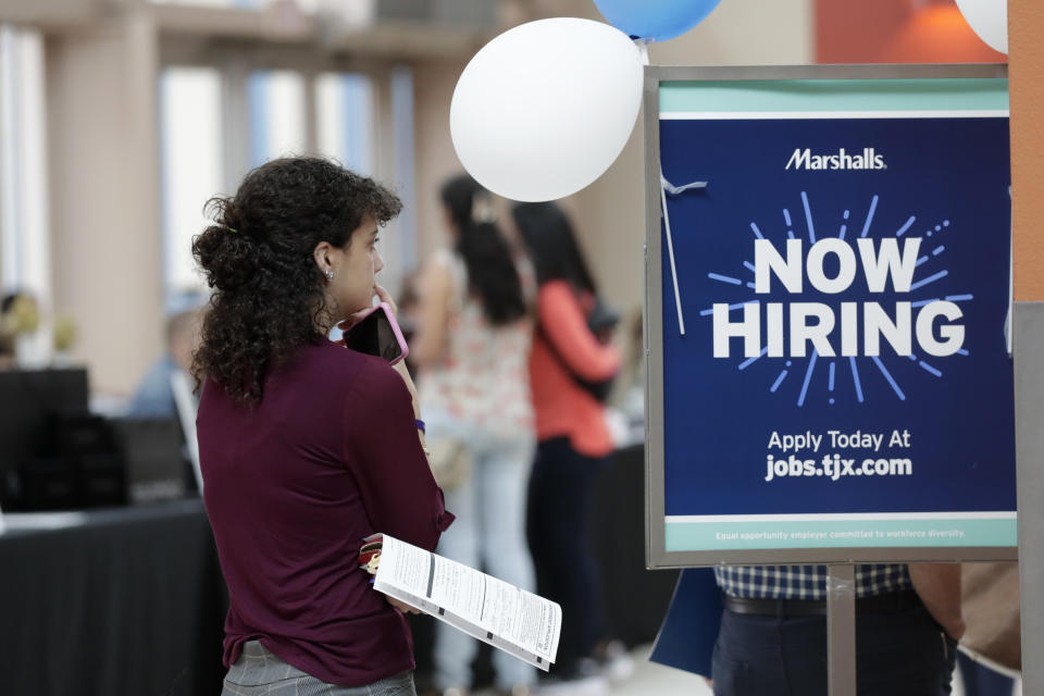 In this Tuesday, Oct. 1, 2019, photo, Daisy Ronco waits in line to apply for a job with Marshalls during a job fair at Dolphin Mall in Miami. On Wednesday, Oct. 2, payroll processor ADP reports how many jobs private employers added in September.  (AP Photo/Lynne Sladky)