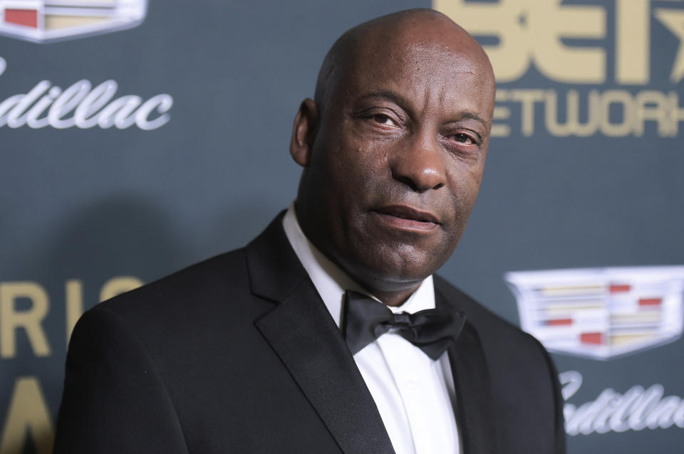 FILE - In this Sunday, Feb. 25, 2018 file photo, John Singleton attends the 2018 American Black Film Festival Honors at the Beverly Hilton Hotel in Beverly Hills, Calif. In April, Hollywood lost director John Singleton, whose 1991 film "Boyz N the Hood" was praised as a realistic and compassionate take on race, class, peer pressure and family. He became the first black director to receive an Oscar nomination and the youngest at 24. (Photo by Richard Shotwell/Invision/AP, File