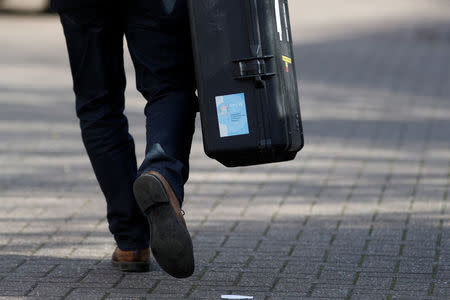 Inspectors from the Organisation for the Prohibition of Chemical Weapons (OPCW) arrive to begin work at the scene of the nerve agent attack on former Russian agent Sergei Skripal, in Salisbury, Britain March 21, 2018. REUTERS/Peter Nicholls