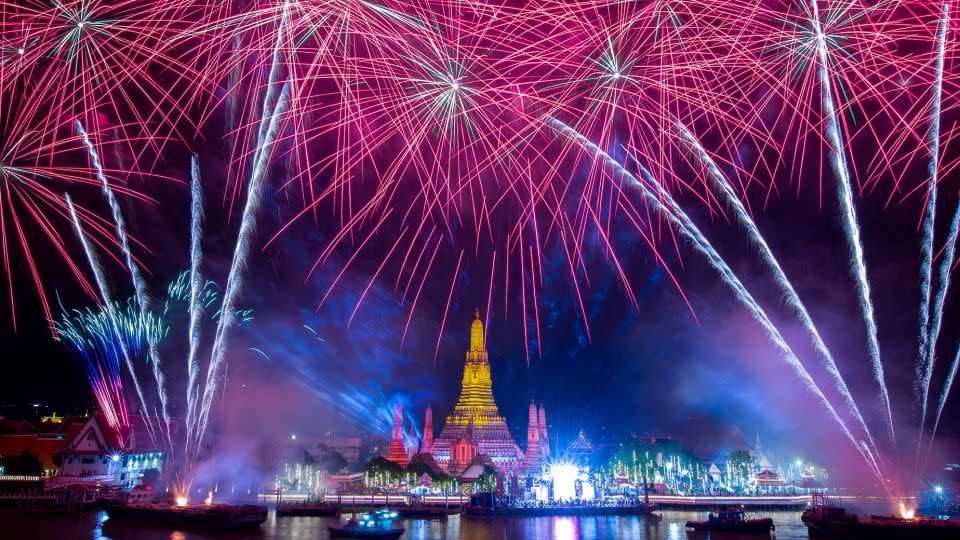 Fireworks explode over Wat Arun in Bangkok during the New Year's Eve celebrations on January 1, 2023. - Athit Perawongmetha/Reuters