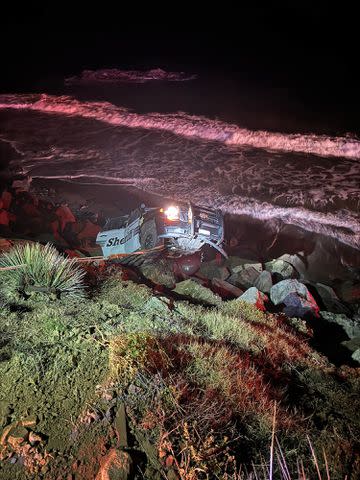 <p>Ventura County Sheriff/Twitter</p> The deputy's patrol car was left dangling off a cliff on the PCH