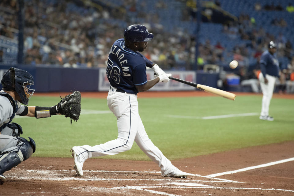 Tampa Bay Rays' Randy Arozarena hits a sacrifice fly against the Detroit Tigers during the first inning of a baseball game Thursday, Sept. 16, 2021, in St. Petersburg, Fla. (AP Photo/Scott Audette)