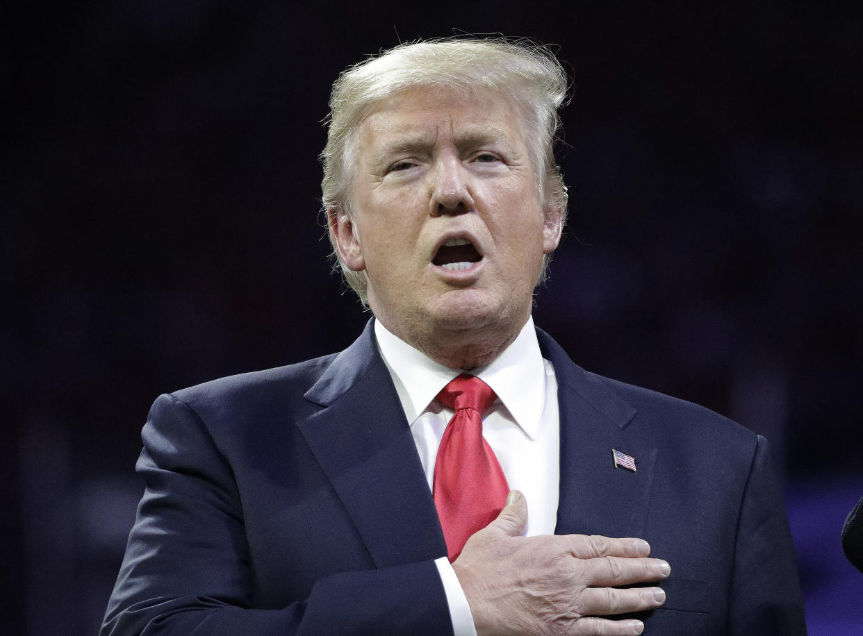 President Donald Trump sings the national anthem before the NCAA college football playoff championship game, and he definitely totally knows the words. (AP Photo)