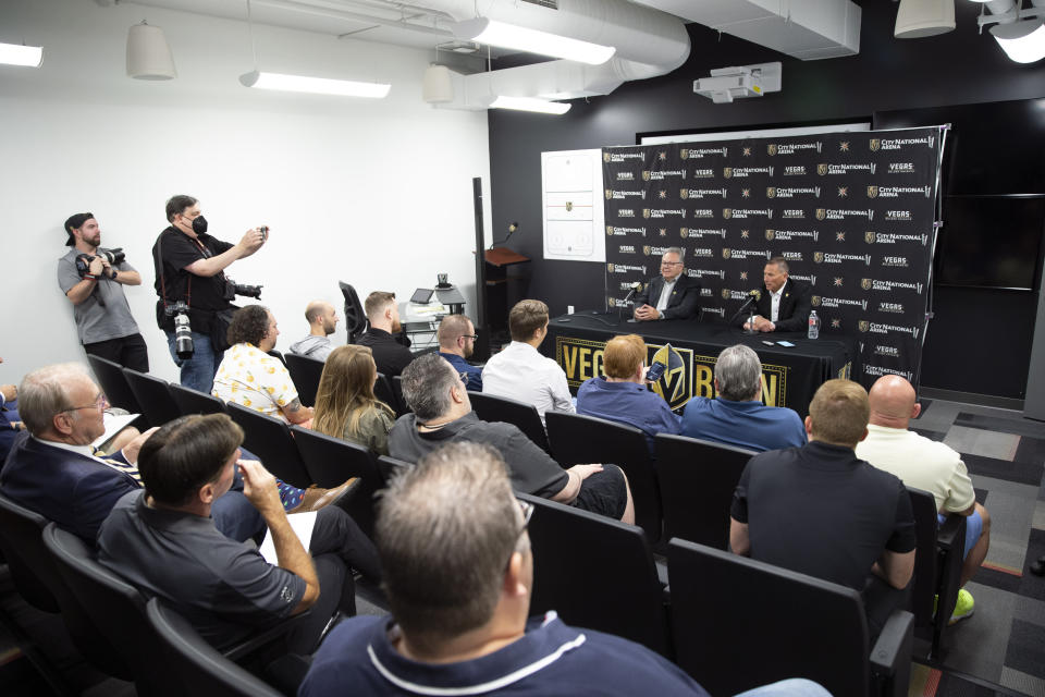 Bruce Cassidy, right, new head coach of the Vegas Golden Knights, and general manager Kelly McCrimmon, left respond to a question during an NHL hockey news conference at City National Arena in Las Vegas, Thursday, June 16, 2022. (Steve Marcus/Las Vegas Sun via AP)