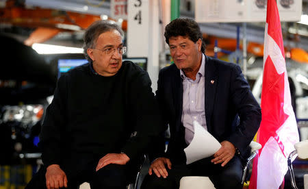 FCA CEO Sergio Marchionne (L) sits with Unifor union president Jerry Dias during the celebration of the production launch of the all-new 2017 Chrysler Pacifica minivan at the FCA Windsor Assembly plant in Windsor, Ontario, May 6, 2016. REUTERS/Rebecca Cook