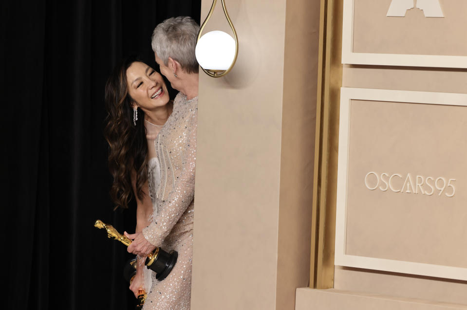 HOLLYWOOD, CALIFORNIA - MARCH 12: Michelle Yeoh, winner of the Best Actress in a Leading Role award for ‘Everything Everywhere All at Once’ Jamie Lee Curtis, winner of Best Actress in a Supporting Role award for ‘Everything Everywhere All at Once’  in the press room during the 95th Annual Academy Awards at Ovation Hollywood on March 12, 2023 in Hollywood, California. (Photo by Rodin Eckenroth/Getty Images)