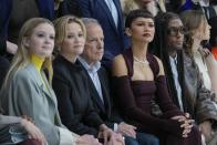 Ava Phillippe, from left, Reese Witherspoon, Michael Burke, Zendaya and Law Roach watch the Fendi Haute Couture Spring-Summer 2024 collection presented in Paris, Thursday, Jan. 25, 2024. (AP Photo/Thibault Camus)