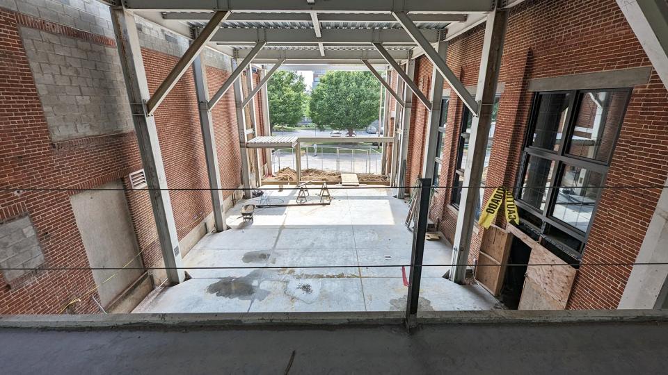 Looking through the main entrance of the new York History Center from a catwalk July 20, 2023. The new floor was poured a few days before.