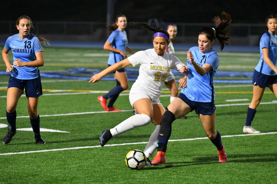 Moorpark freshman Zaina Barakat turns away from a Camarillo High player during the Musketeers' 2-0 win at Camarillo on Jan. 24.