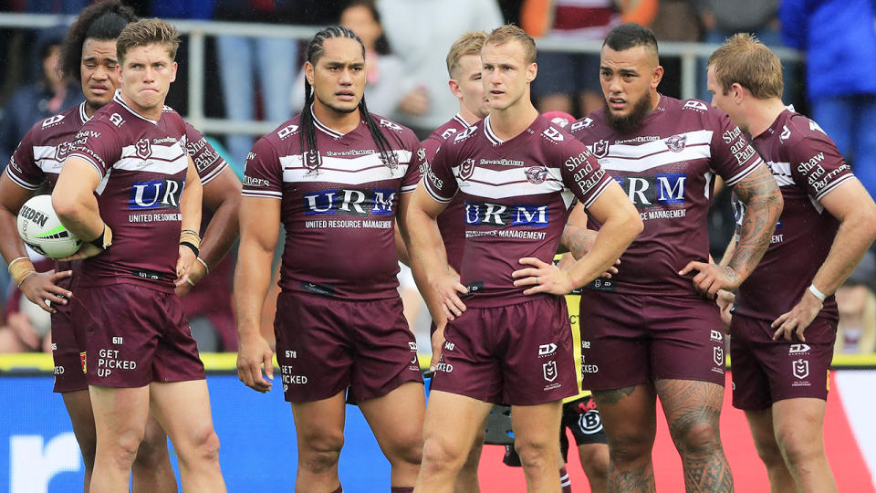 Manly players, pictured here looking on during their clash with the Melbourne Storm.