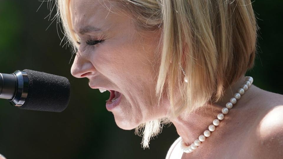 Evangelist Paula White, chair of the White House evangelical advisory board, says a prayer for President Donald Trump during last May’s National Day of Prayer service in the White House Rose Garden. (Photo by Chip Somodevilla/Getty Images)