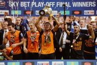 Britain Soccer Football - Hull City v Sheffield Wednesday - Sky Bet Football League Championship Play-Off Final - Wembley Stadium - 28/5/16 Hull City's Chuba Akpom lifts the trophy as they celebrate winning promotion back to the Premier League Action Images via Reuters / Tony O'Brien Livepic EDITORIAL USE ONLY. No use with unauthorized audio, video, data, fixture lists, club/league logos or "live" services. Online in-match use limited to 45 images, no video emulation. No use in betting, games or single club/league/player publications. Please contact your account representative for further details.