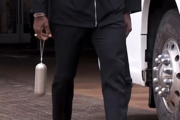 LeBron James carrying what looks like a new Beats Pill speaker.