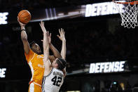 Tennessee forward Tobe Awaka shoots over Vanderbilt forward Quentin Millora-Brown (42) during the second half of an NCAA college basketball game Wednesday, Feb. 8, 2023, in Nashville, Tenn. (AP Photo/Wade Payne)