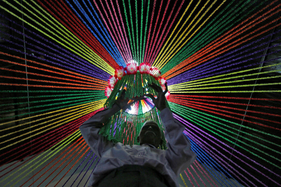 A man decorates a church ahead of Christmas celebrations in Ahmedabad