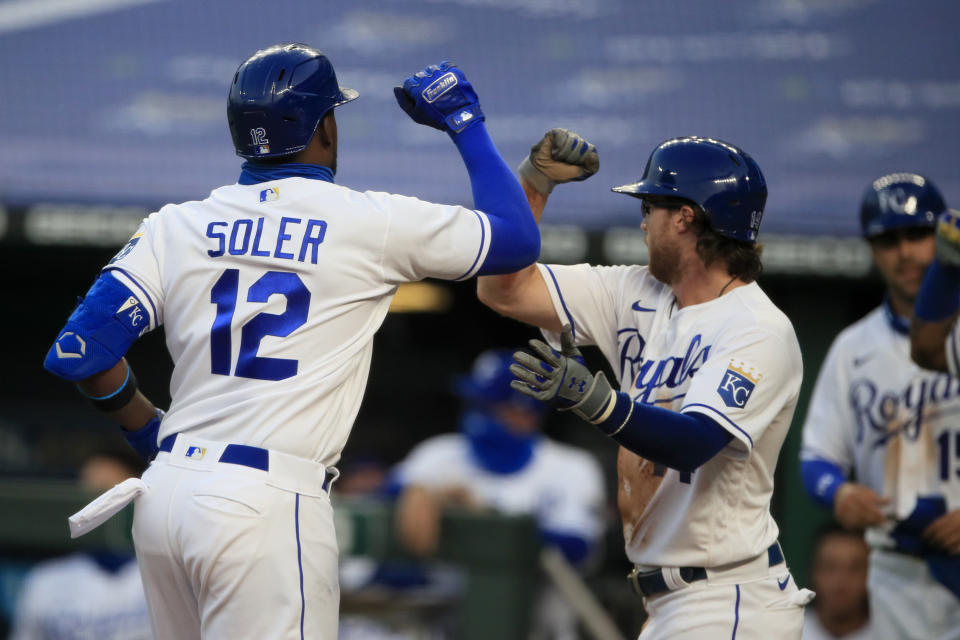 Kansas City Royals' Jorge Soler (12) is congratulated by teammate Brett Phillips, right, after hitting a three-run home run in the fourth inning of a baseball game against the Minnesota Twins at Kauffman Stadium in Kansas City, Mo., Saturday, Aug. 8, 2020. (AP Photo/Orlin Wagner)