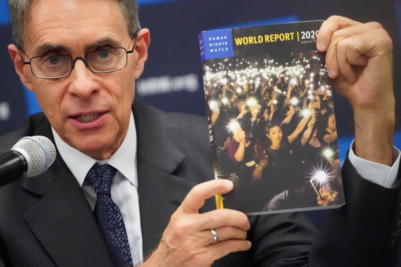 Kenneth Roth, the Executive Director of Human Rights Watch holds up their World Report 2020 at the United Nations in the Manhattan borough of New York City