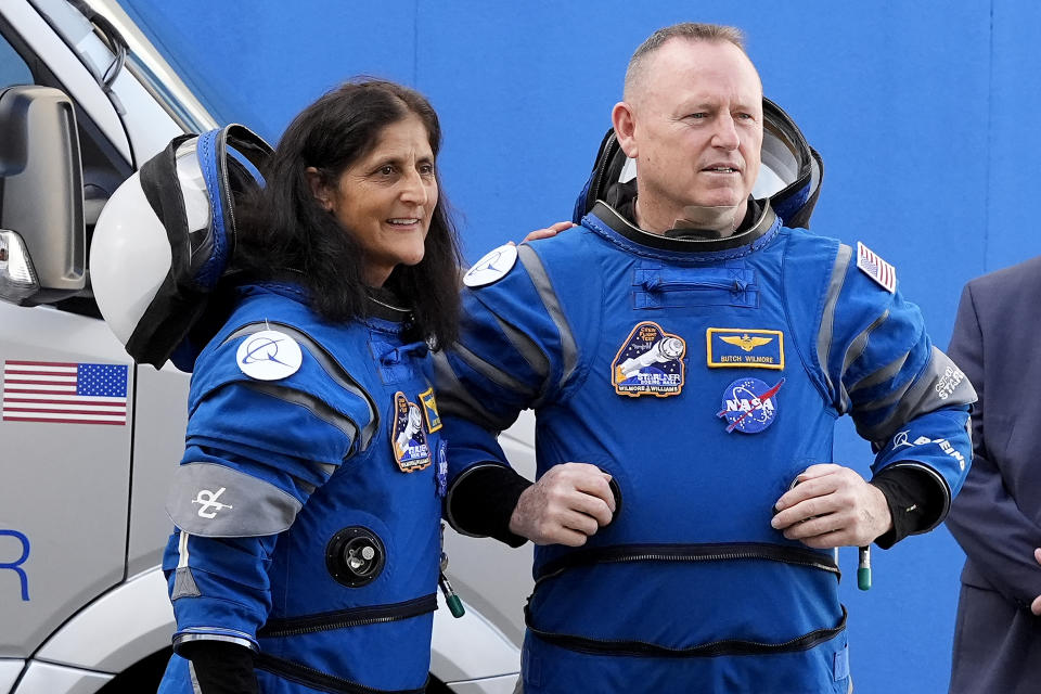 NASA astronauts Suni Williams, left, and Butch Wilmore talk to family members as they leave the operations and checkout building for a trip to launch pad at Space Launch Complex 41 Saturday, June 1, 2024, in Cape Canaveral, Fla. The two astronauts are scheduled to liftoff later today on the Boeing Starliner capsule for a trip to the international space station. . (AP Photo/John Raoux)