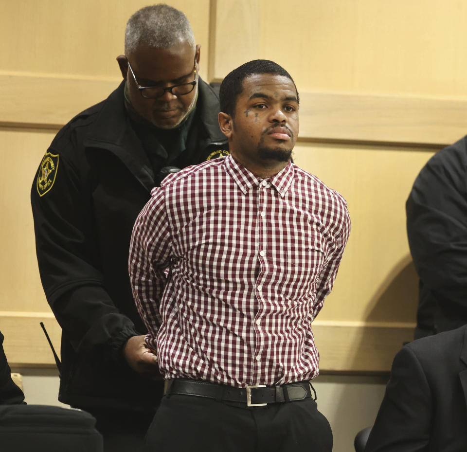 CORRECTS ID TO DEDRICK WILLIAMS INSTEAD OF TRAYVON NEWSOME - Dedrick Williams is handcuffed after he was found guilty of first-degree murder of emerging rapper XXXTentacion at the Broward County Courthouse in Fort Lauderdale on Monday, March 20, 2023. XXXTentacion, born Jahseh Onfroy, 20, was killed during a robbery outside of Riva Motorsports in Deerfield Beach in 2018. (Carline Jean/South Florida Sun-Sentinel via AP, Pool)