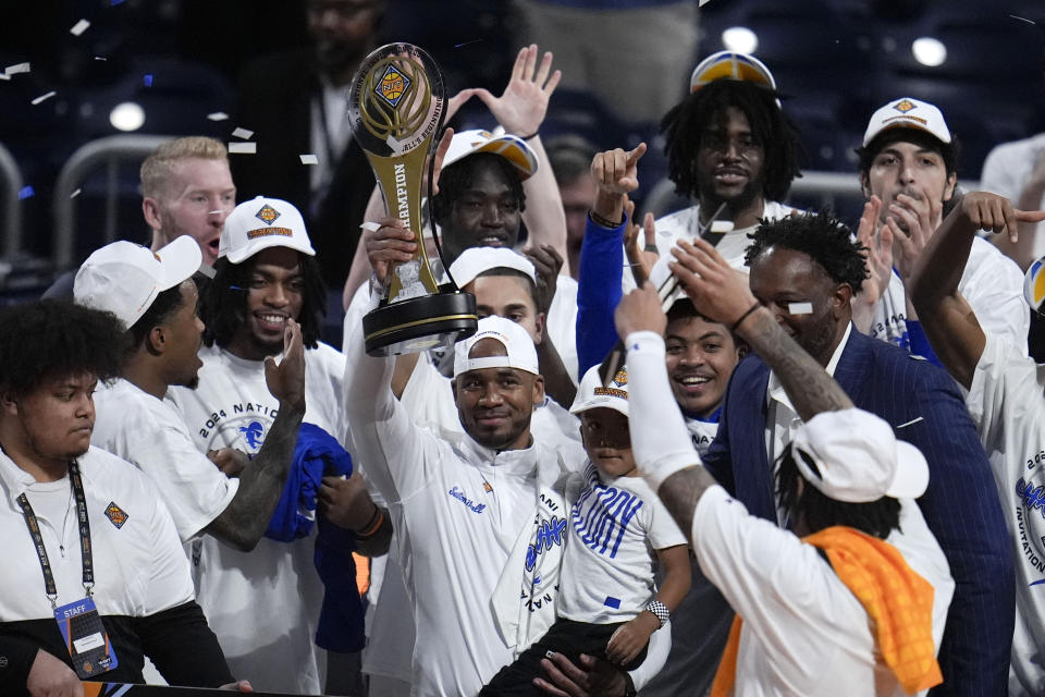 Seton Hall head coach Shaheen Holloway celebrates with his team after an NCAA college basketball game against Indiana State for the championship of the NIT, Thursday, April 4, 2024, in Indianapolis. Seton Hall won 79-77. (AP Photo/Michael Conroy)