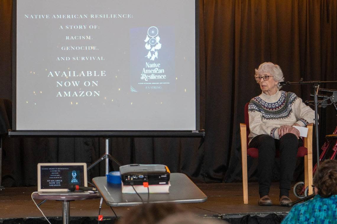 Pat Streng, the author of “Native American Resilience,” spoke about her experience writing her book during an event honoring indigenous people hosted by the Clay Countians for Inclusion at Garrison School on Saturday, Nov 5, 2022, in Liberty. Emily Curiel/ecuriel@kcstar.com