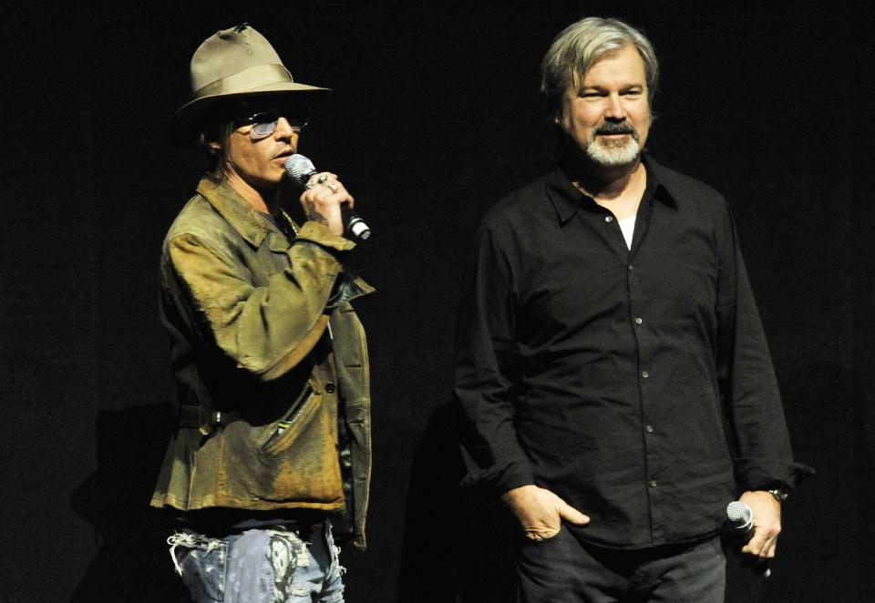 File - In this Wednesday, April 17, 2013 file photo, Johnny Depp, left, who plays Tonto in the upcoming film "The Lone Ranger," speaks to theater owners and media as the film's director Gore Verbinski looks on during the Walt Disney Studios presentation at CinemaCon 2013 at Caesars Palace, in Las Vegas. (Photo by Chris Pizzello/Invision/AP, File)