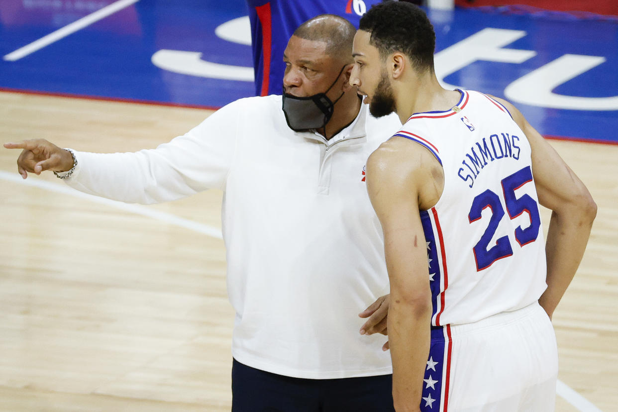 PHILADELPHIA, PENNSYLVANIA - APRIL 28: Head coach Doc Rivers of the Philadelphia 76ers speaks with Ben Simmons #25 during the first quarter against the Atlanta Hawks at Wells Fargo Center on April 28, 2021 in Philadelphia, Pennsylvania. NOTE TO USER: User expressly acknowledges and agrees that, by downloading and or using this photograph, User is consenting to the terms and conditions of the Getty Images License Agreement. (Photo by Tim Nwachukwu/Getty Images)