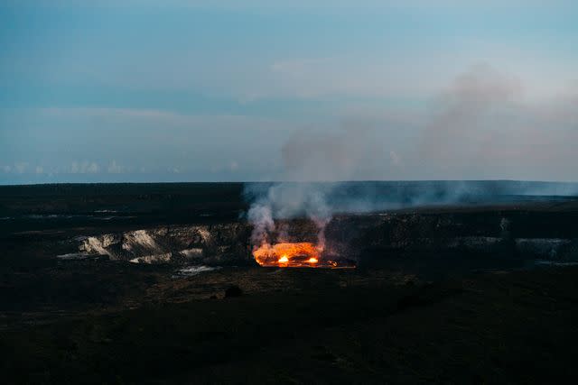 <p>Laura La Monaca/Travel + Leisure</p> Small eruption in Hawaii Volcanos National Park.