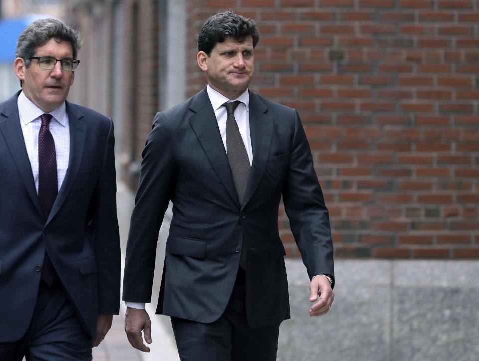 Gordon Caplan, right, arrives at federal court, Thursday, Oct. 3, 2019, in Boston, for sentencing in a nationwide college admissions bribery scandal. (AP Photo/Steven Senne)