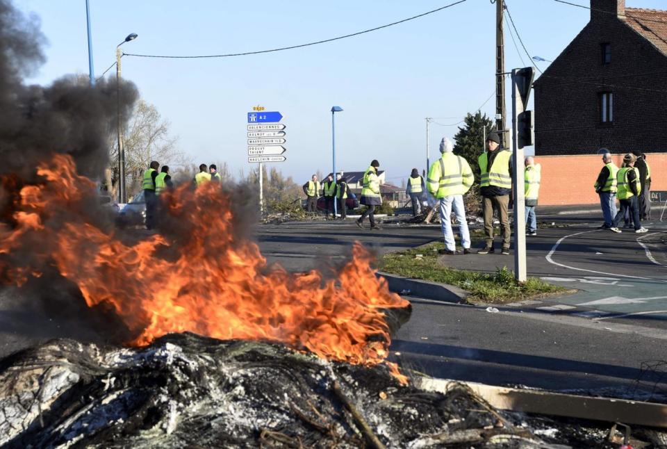 Protesters stand by a fire in Douchy-les-Mines, northern France, on Sunday (AFP/Getty Images)