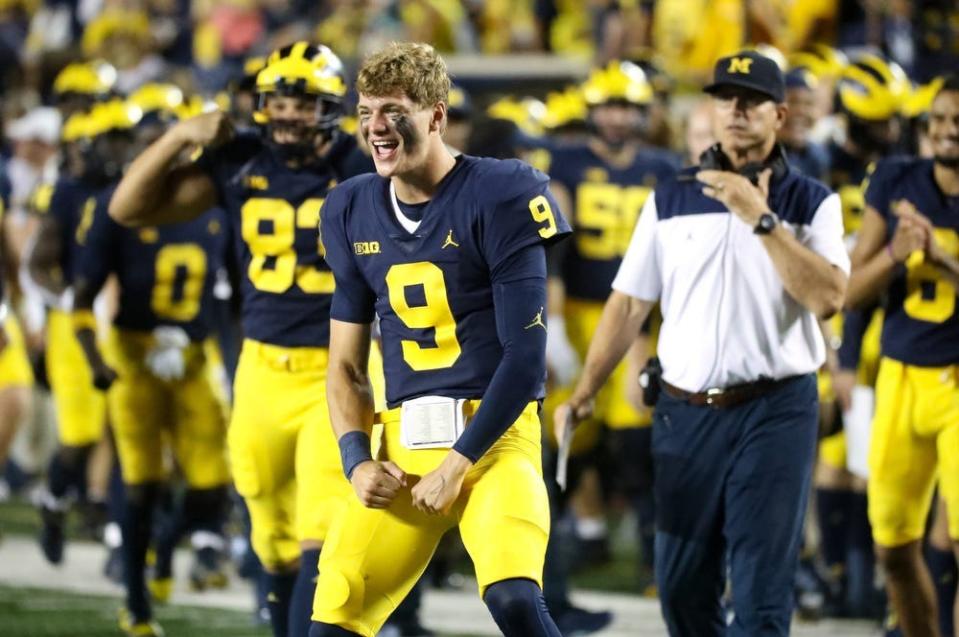 Michigan Wolverines quarterback J.J. McCarthy (9) celebrates on the sidelines during action against the Hawaii Warriors at Michigan Stadium Saturday, September 10, 2022.

Mich2