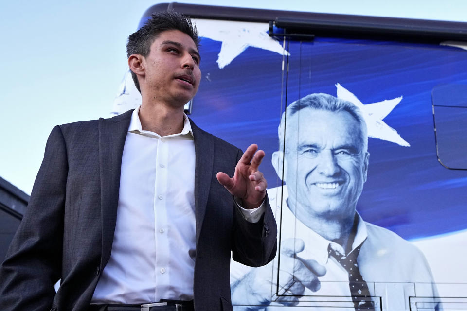 Anthony Garcia waits in line to enter a voter rally for Independent presidential candidate Robert F. Kennedy Jr., Wednesday, Dec. 20, 2023, in Phoenix. (AP Photo/Matt York)