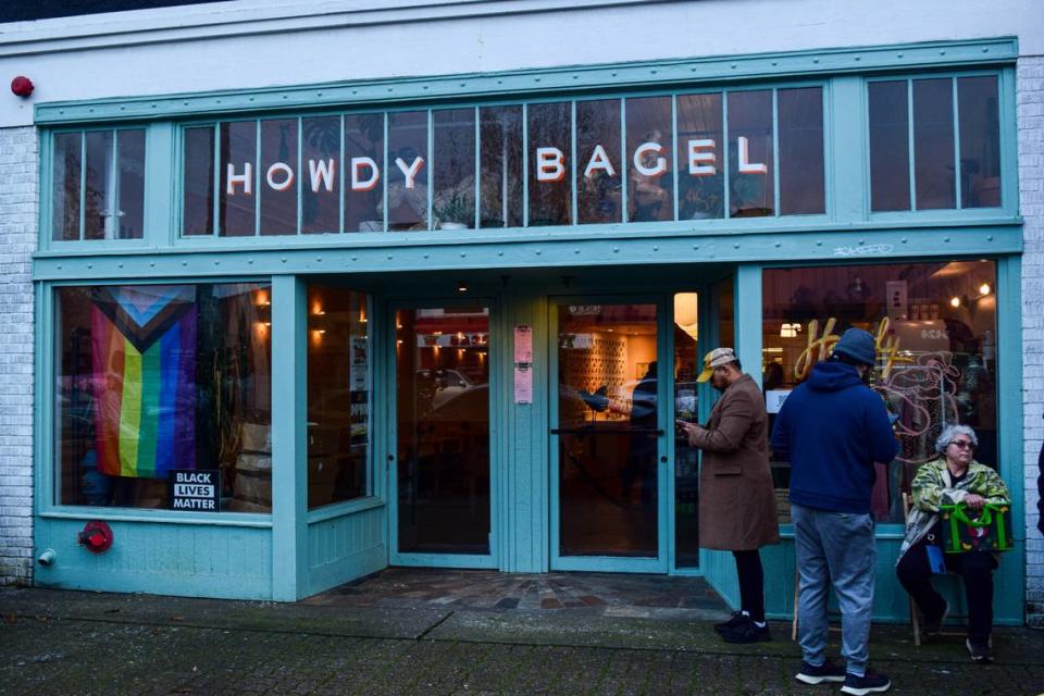 Shaynedonovan Elliott, left and Saracristina Garcia, seated, were among the first three customers at Howdy Bagel’s reopening on Feb. 7, 2024.