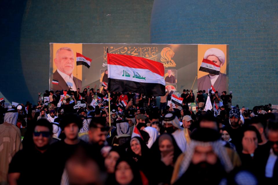 Followers of a political movement called "Al-Fateh Alliance" chant during a rally before the parliamentary elections in Baghdad, Iraq, Thursday, Oct. 7, 2021. Iraq on Sunday, Oct. 10, holds its fifth election since the 2003 U.S.-led invasion that toppled Iraqi dictator Saddam Hussein, with most Iraqis longing for real change. (AP Photo/Hadi Mizban)