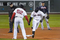 Boston Red Sox's Jackie Bradley Jr. is congratulated by third base coach Carlos Febles on his solo home run during the fourth inning of a baseball game against the Atlanta Braves, Wednesday Sept. 2, 2020, in Boston. (AP Photo/Charles Krupa)