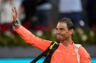 Rafael Nadal, of Spain, waves to the crowd after losing a match against Jiri Lehecka, of Czech Republic, during the Mutua Madrid Open tennis tournament in Madrid, Tuesday, April 30, 2024. (AP Photo/Manu Fernandez)