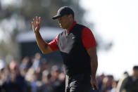 Tiger Woods waves to the gallery on the third green during the final round of the Genesis Invitational golf tournament at Riviera Country Club, Sunday, Feb. 19, 2023, in the Pacific Palisades area of Los Angeles. (AP Photo/Ryan Kang)