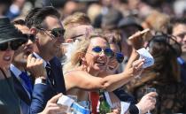 <p>Pictured: Punters brave wild weather as Melbourne Cup festivities get underway</p>