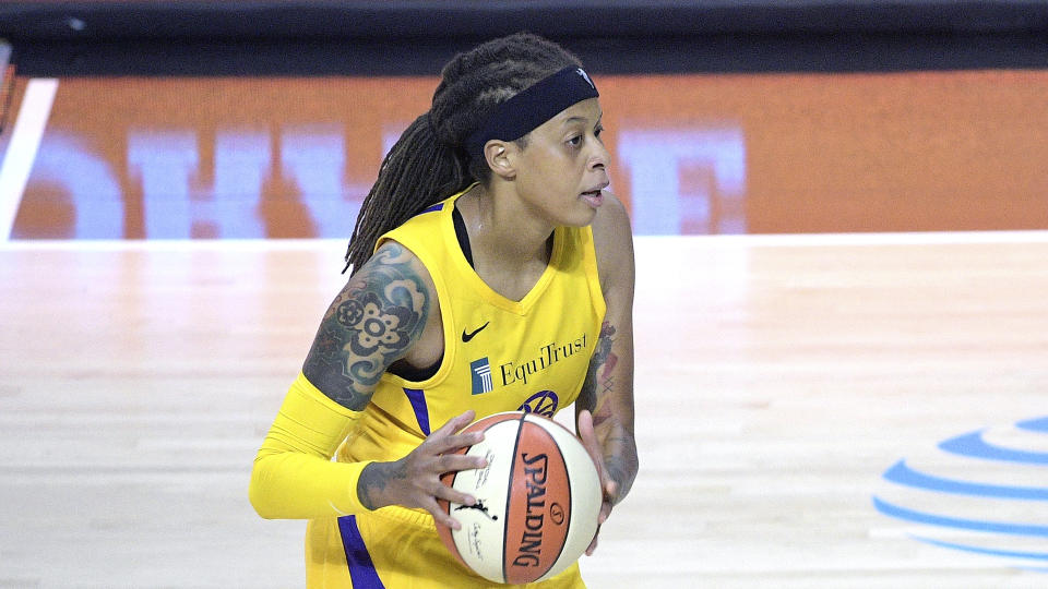 Los Angeles Sparks guard Seimone Augustus (33) sets up a play during the first half of a WNBA basketball game against the Phoenix Mercury, Saturday, July 25, 2020, in Bradenton, Fla. (AP Photo/Phelan M. Ebenhack)