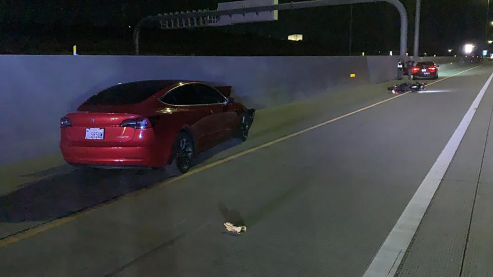 This photo provided by Utah Department of Public Safety shows the scene of an accident involving a Tesla and a motorcycle on July 24, 2022 near Draper, Utah. Two crashes involving Teslas apparently running on Autopilot are drawing scrutiny from federal regulators and point to a potential new hazard on U.S. freeways: The partially automated vehicles may not stop for motorcycles. (Utah Department of Public Safety via AP)