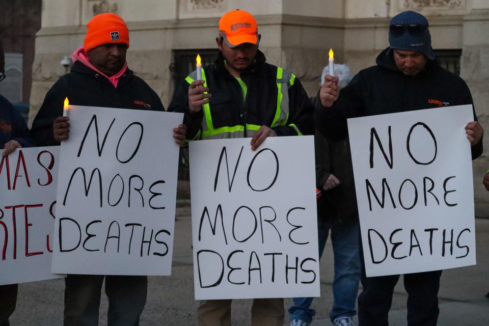Construction workers gather during a vigil in front of City Hall in Jersey City on Feb. 8 to remember Juan Jose Coc and other construction workers injured or killed on Jersey City construction sites.