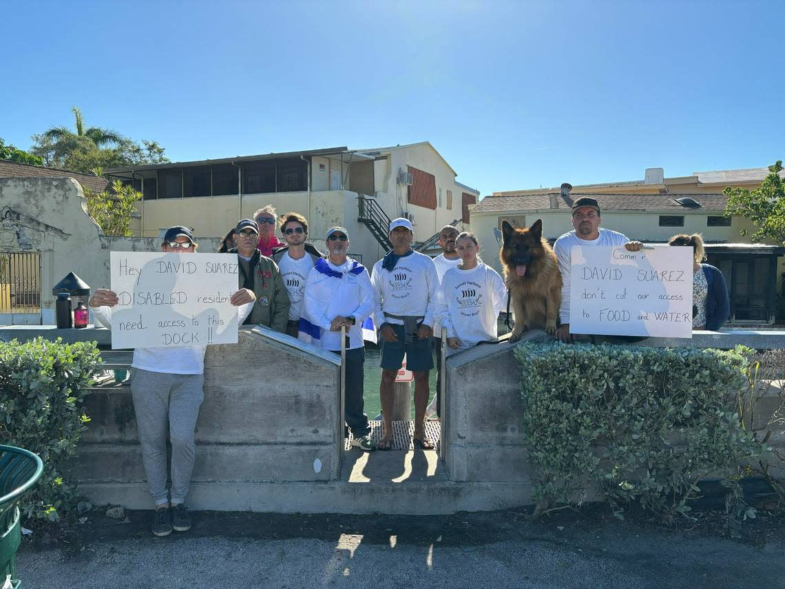 People who live on boats in Biscayne Bay protest a decision by Miami Beach officials to restrict access to a dock near Dade Boulevard and Michigan Avenue on Tuesday, Dec. 19, 2023.