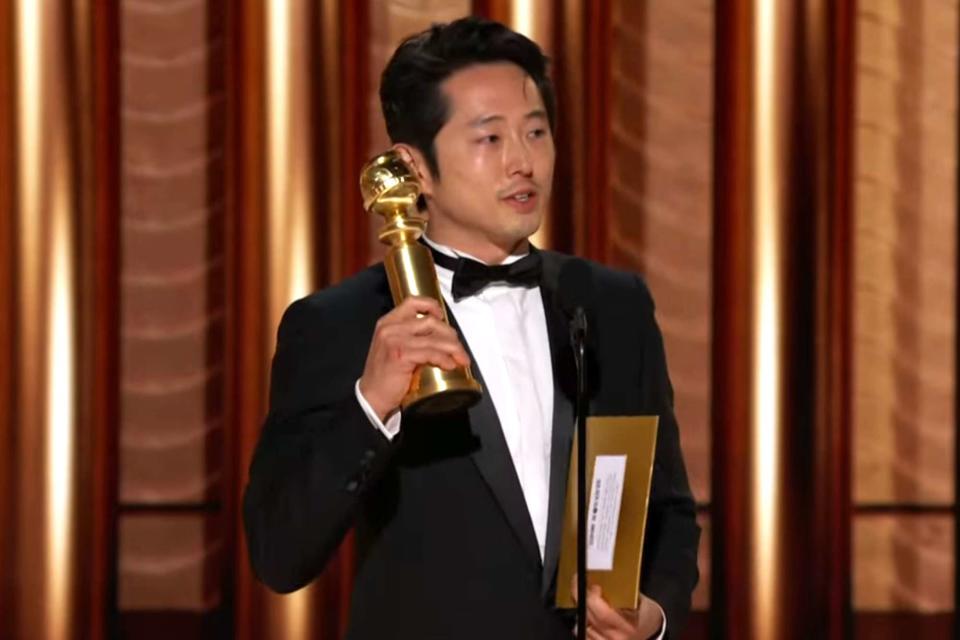 <p>CBS</p> Steven Yeun winning at the Golden Globes 2024