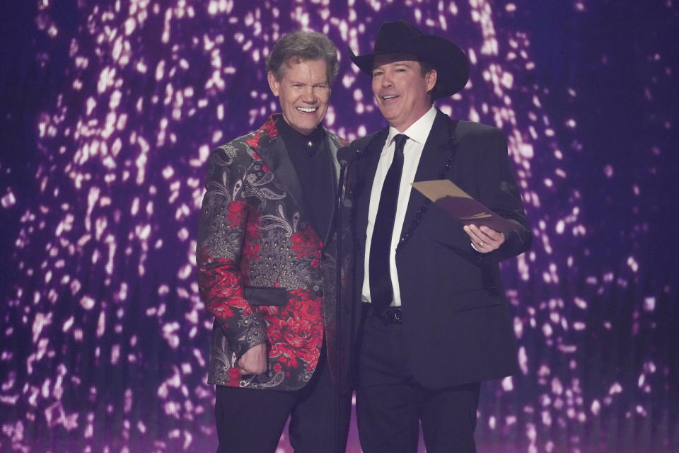 Randy Travis, left, and Clay Walker present the award for song of the year during the 59th annual Academy of Country Music Awards on Thursday, May 16, 2024, at the Ford Center in Frisco, Texas. (AP Photo/Chris Pizzello)