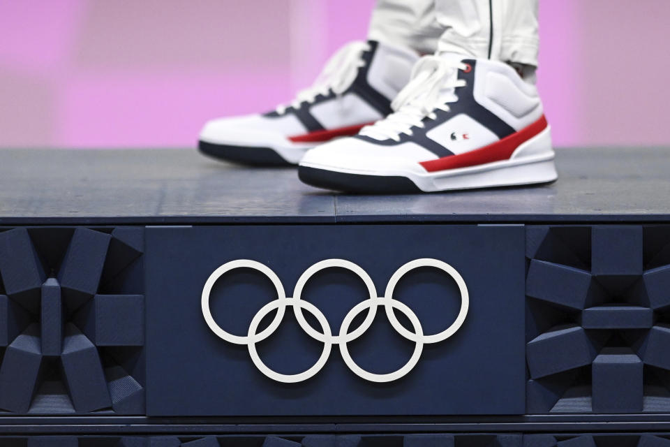 02 August 2021, Japan, Tokio: Shooting: Olympics, preliminary competition, Ol. rapid fire pistol 25 m, men, final, award ceremony, Asaka Shooting Range. The shoes of gold medallist Jean Quiquampoix from France. Photo by: Swen Pf'rtner/picture-alliance/dpa/AP Images - Credit: Swen Pf'rtner/picture-alliance/dpa/AP Images